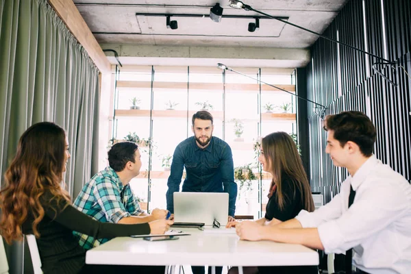 Business people having board meeting in modern office. Teamwork