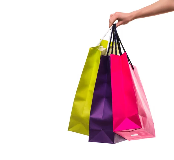 Woman hand with shopping bags on white background — Stock Photo, Image