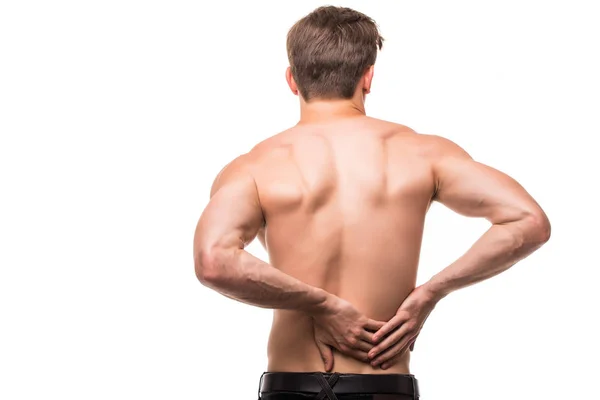 Young man with back pain in back on white background — Stock Photo, Image