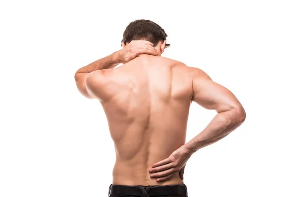 Jonge man met rugpijn in de rug op witte achtergrond — Stockfoto