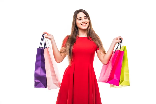 Belle femme sourire avec des sacs de couleur shoping dans les mains sur fond blanc — Photo