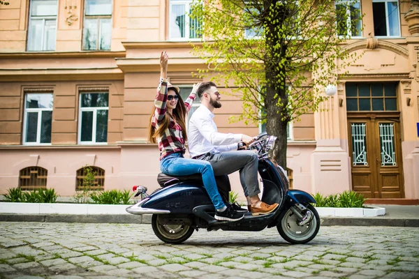 Couple in love riding a motorbike , Handsome guy and young sexy woman travel .