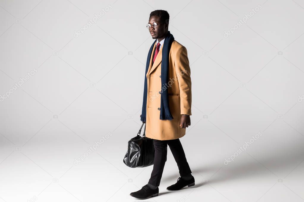 african businessman with bag isolated on white