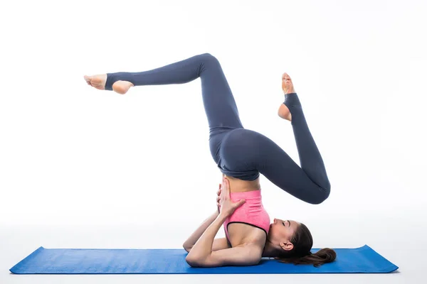 Konsep pose yoga oleh wanita cantik ramping, terisolasi di latar belakang putih — Stok Foto