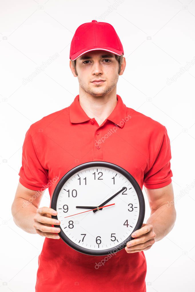 Delivery man with clock in hands on white
