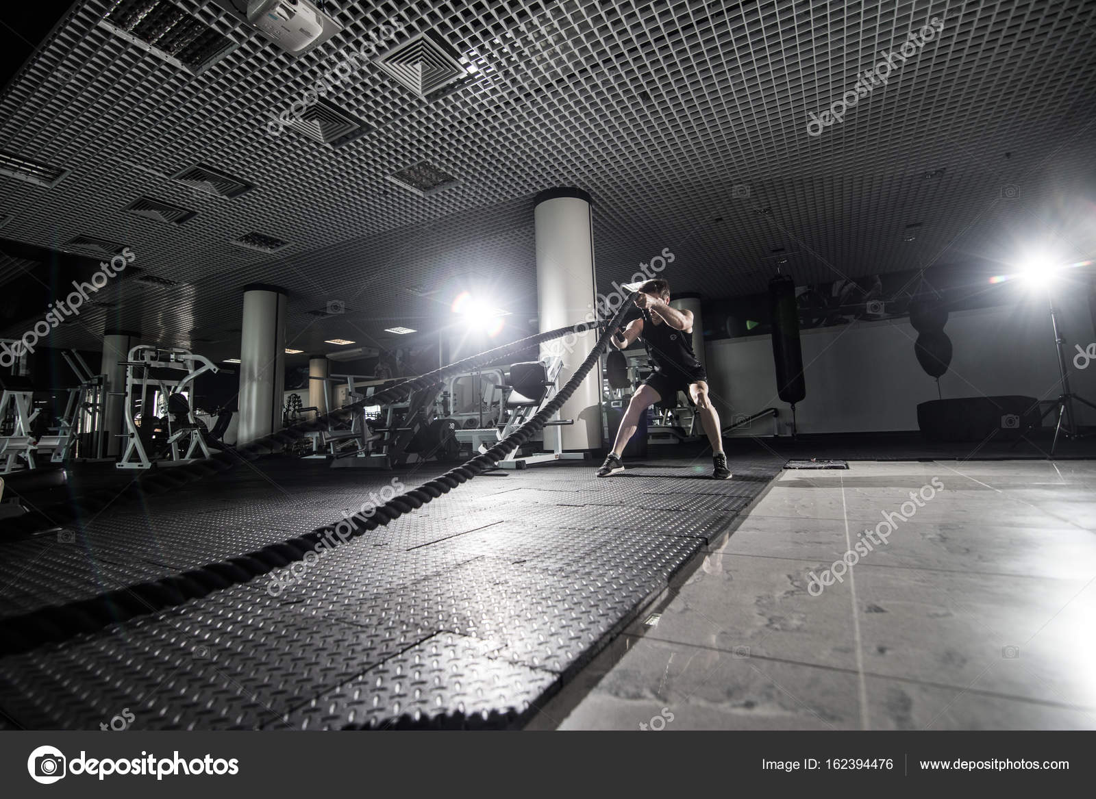 Fitness Man Working Out With Battle Ropes At Gym Battle Ropes