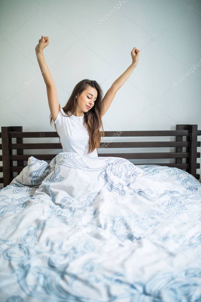 Happy beauty morning of beauty girl streching in bed