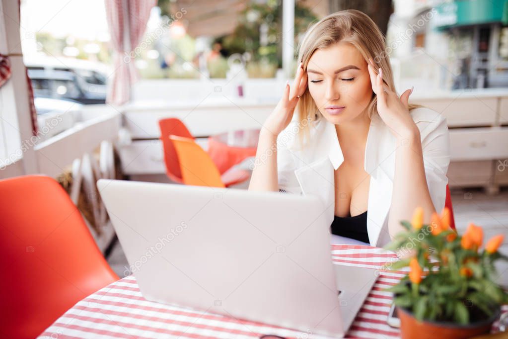 Business Woman Having Headache While Working Using Laptop Computer.