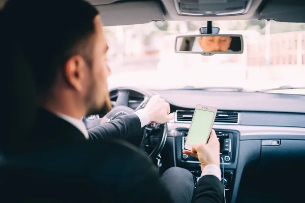 Portrait of handsome business man use phone in car — Stock Photo, Image