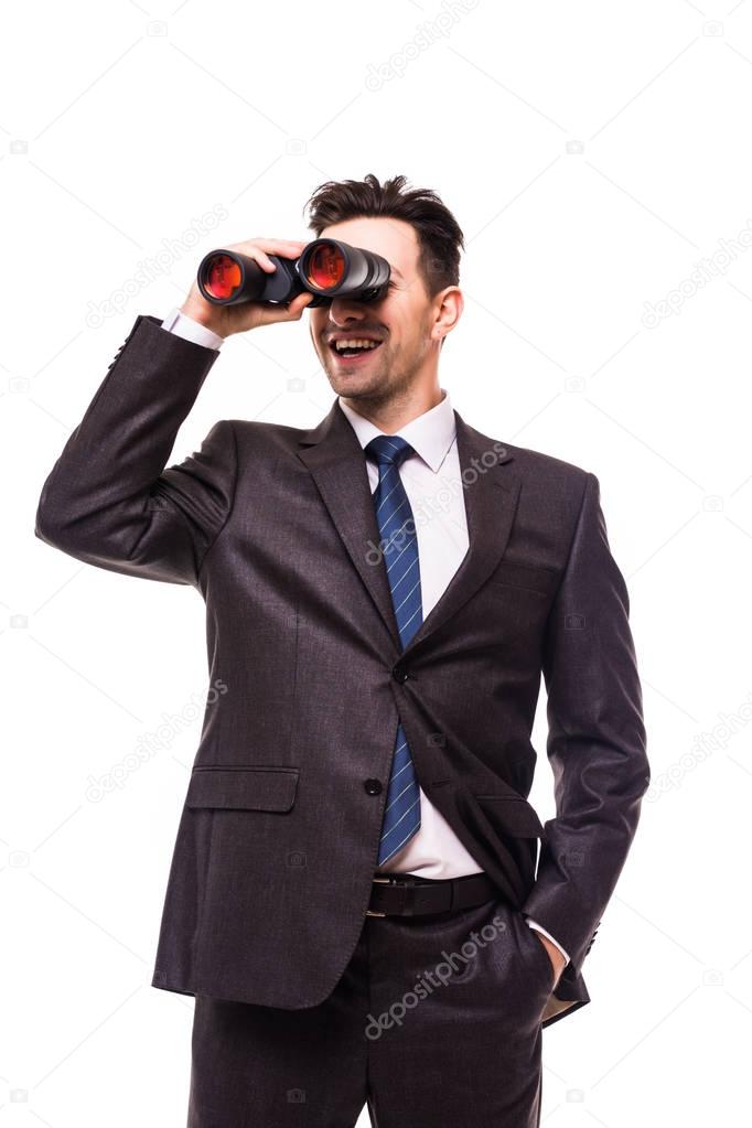 Young businessman wearing formal suit and seeing through binoculars, isolated on white