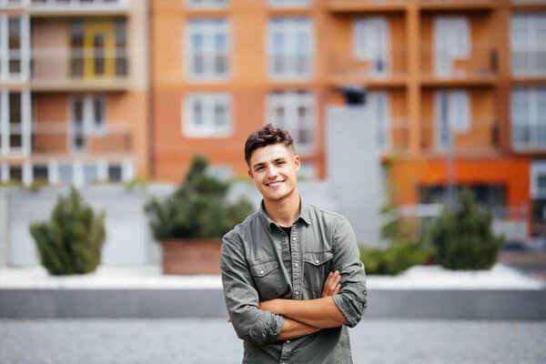 portrait of a trendy young man in the city street