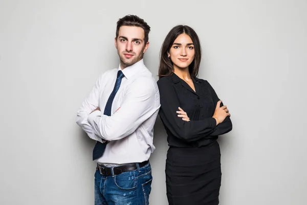 Man and woman standing back to back on gray background