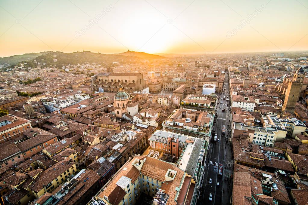 Aerial view of Bologna, Italy at sunset. Colorful sky over the historical city center and old buildings