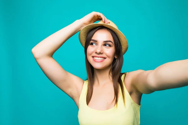 Beauty woman is taking photo self portrait on a smartphone in the city closeup screen over colorful green background — Stock Photo, Image