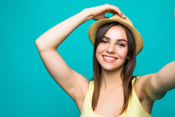 Beauty woman is taking photo self portrait on a smartphone in the city closeup screen over colorful green background — Stock Photo, Image