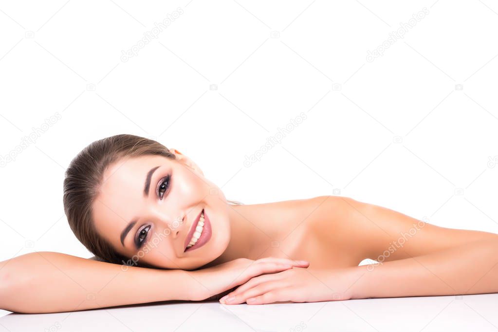 People, Beauty Woman face Portrait. Beautiful Spa model Girl with Perfect Fresh Clean Skin. Brunette female looking at camera and smiling. Youth and Skin Care Concept.