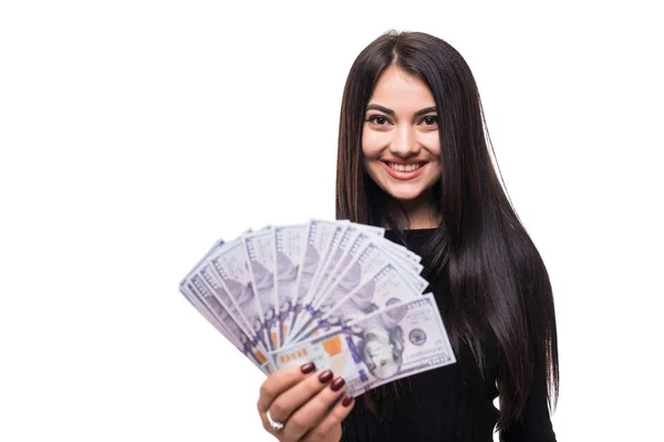 Щаслива успішна молода жінка тримає долари в руках з зубним посмішкою на білому тлі — стокове фото