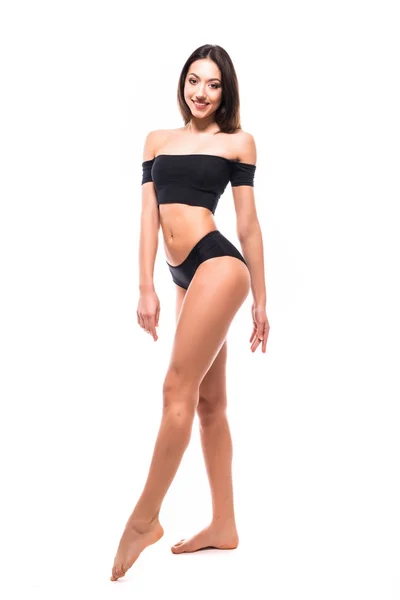 Mooie vrouw met perfecte sport lichaam in zwarte ondergoed geïsoleerd op een witte pagina. Perfect lichaam. Volledige lengte portret — Stockfoto
