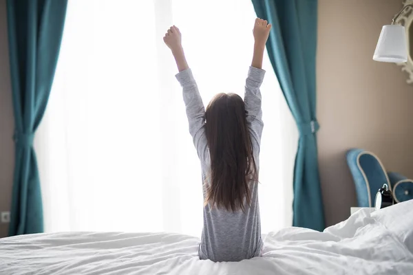 Nice child girl enjoys sunny morning. Good morning at home. Child girl wakes up from sleep. — Stock Photo, Image