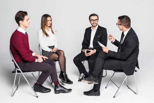 Creative business people meeting in circle of chairs and discuss with team leader isolated on white background