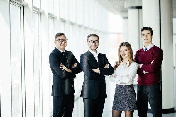 The business people walk in the office hall standing and posing on camera — Stock Photo, Image