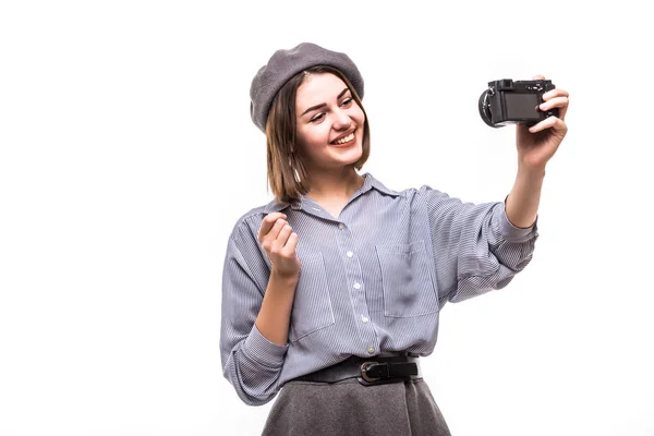 Portrait of a happy woman blogger wearing beret speak to camera while record video isolated over white background — Stock Photo, Image