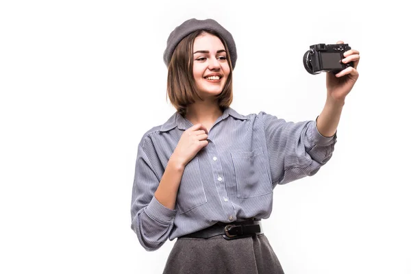 Portrait of a happy woman blogger wearing beret speak to camera while record video isolated over white background — Stock Photo, Image
