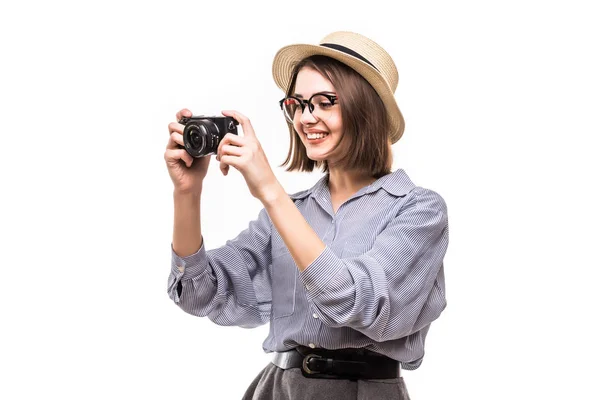 Portrait of smiling woman with photo camera looking at camera isolated on white — Stock Photo, Image
