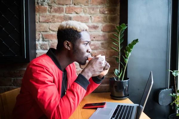 Portrait of afro man drink cup of coffee in cafeteria — Stok Foto