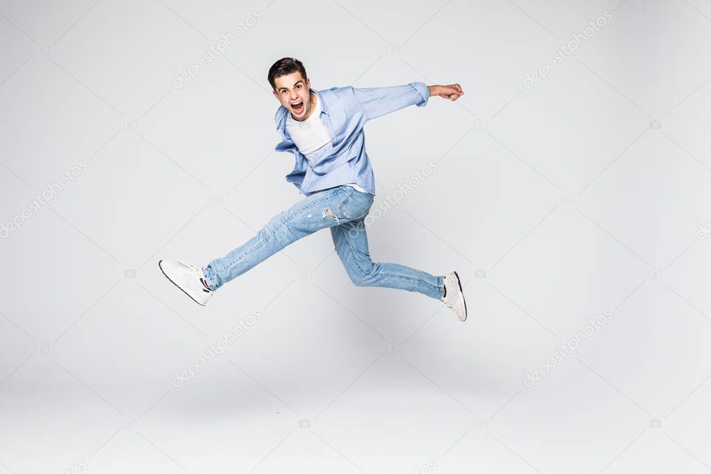 Success win winner achievement goal lifestyle leisure sexy people person cool swag people person concept. Full-length full-size portrait of attractive muscular guy jumping up isolated gray background