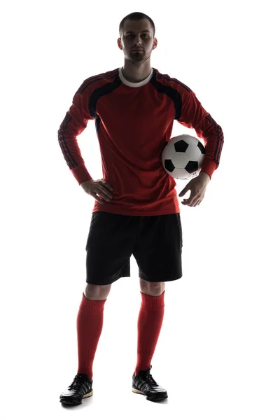 Silhouette de jeune joueur avec ballon de football dans les mains isolées sur fond blanc — Photo