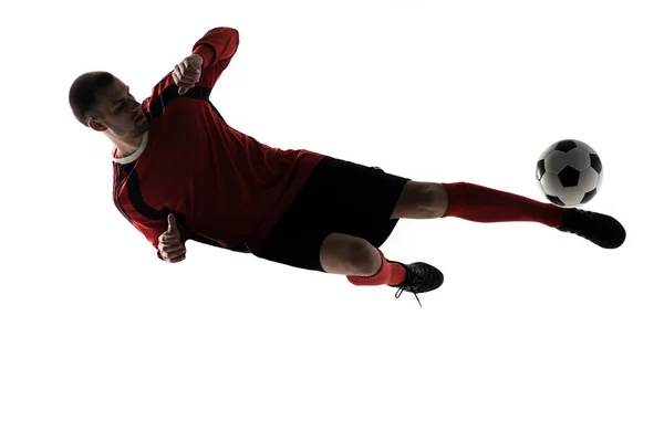 足球运动员球员踢在剪影被隔绝在白色背景上 — 图库照片