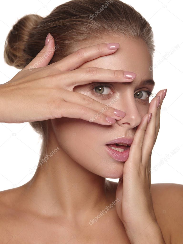 Emotional portrait of a young european girl with pure and healthy  glowing smooth skin without makeup, a lot of emotions on her face, white isolated background, studio shoot