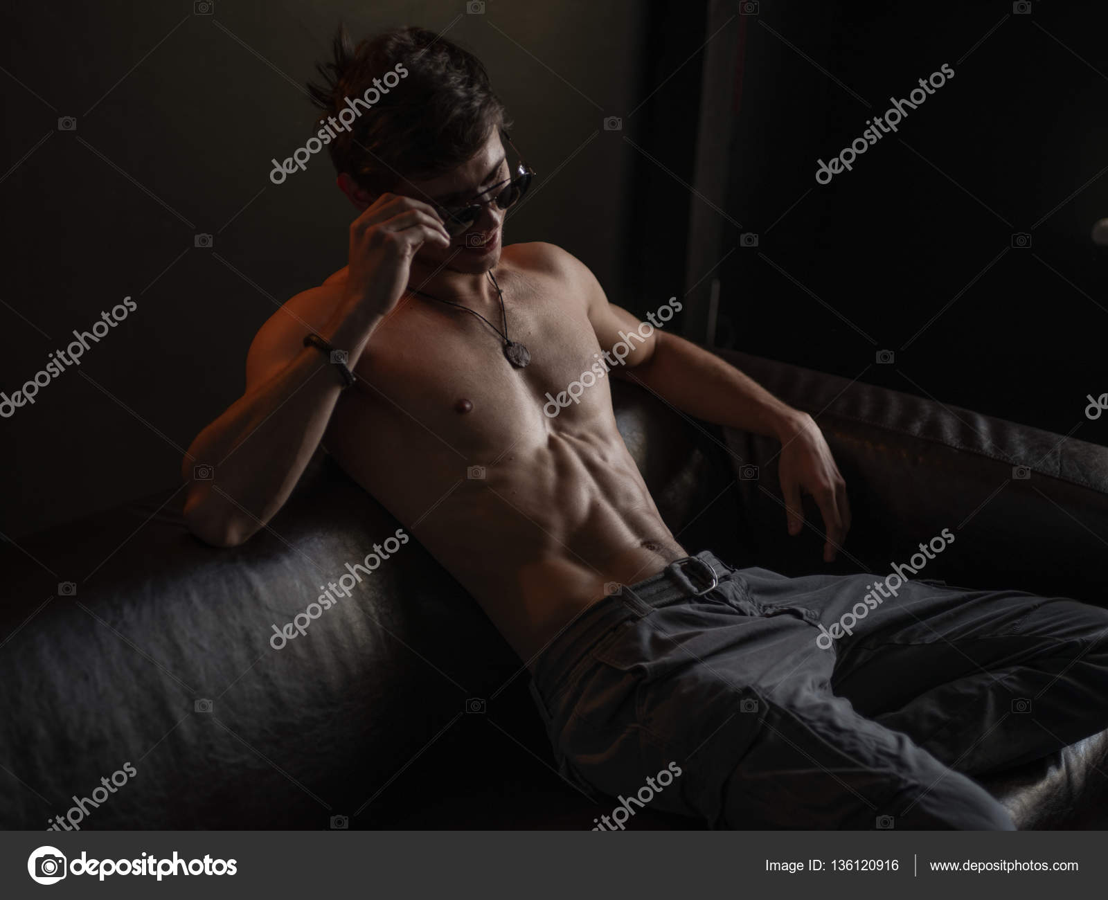 naked ru boys model Hot, beautiful, self-confident and narcissistic guy with athletic body ( naked torso with sexy abdominal) wearing sunglasses is posing indoors on  the leather sofa — Stock Photo © vostrikov_stocks.mail.ru #136120916
