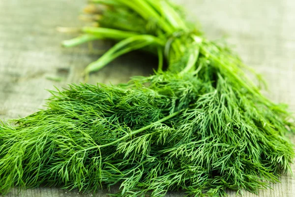 Bunch of dill on a wooden table