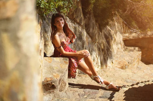 Romantic woman in red dress in old Europe background