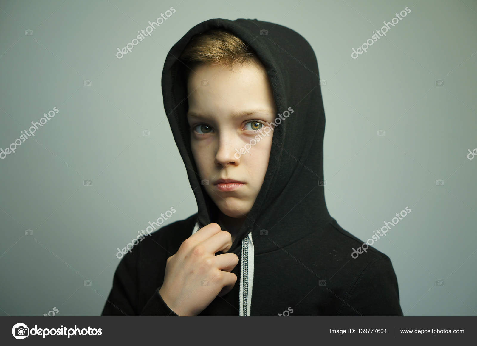 Teenage Bad Boy With Slingshot And Stylish Haircut Studio Shot