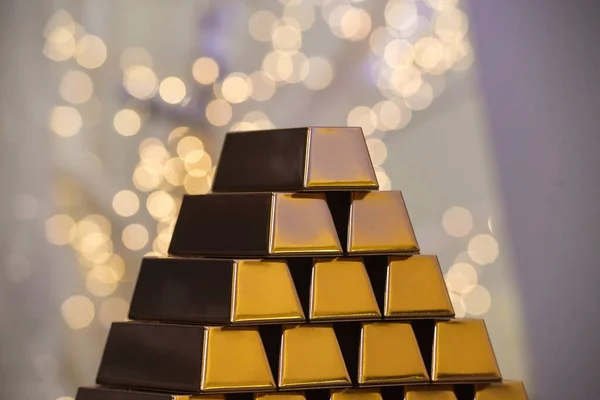 Gold ingots stacked in pyramid