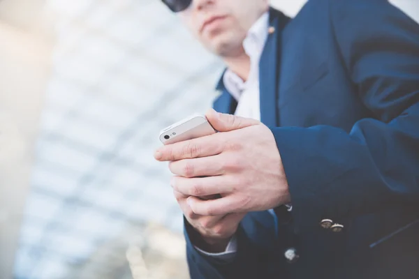 Businessman with telephone in hand.