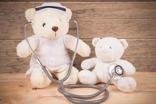 Cute White Teddy bear wear nurse use stethoscope check health bear baby