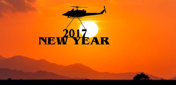 Nový rok 2017 koncept, vrtulník se do textu 2017 západu slunce backgrkound — Stock fotografie