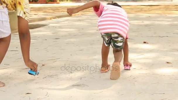 Cute little asian boy playing with car toy — Stock Video