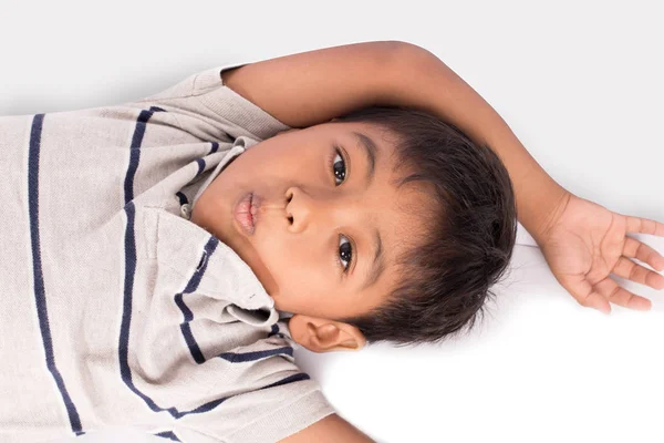 Cute asian little boy lying on floor — Stock Photo, Image