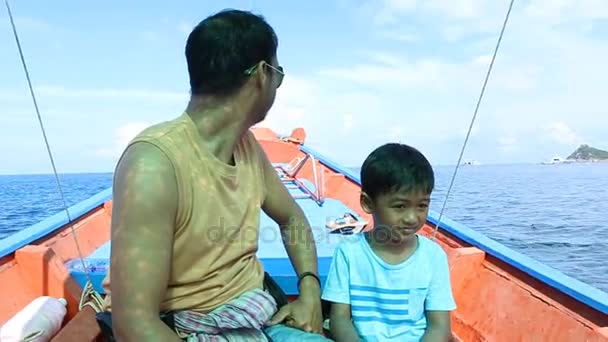 Cute little boy and father sitting on boat — Stock Video