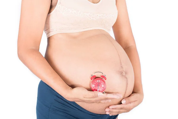 Mujer embarazada con tiempo — Foto de Stock