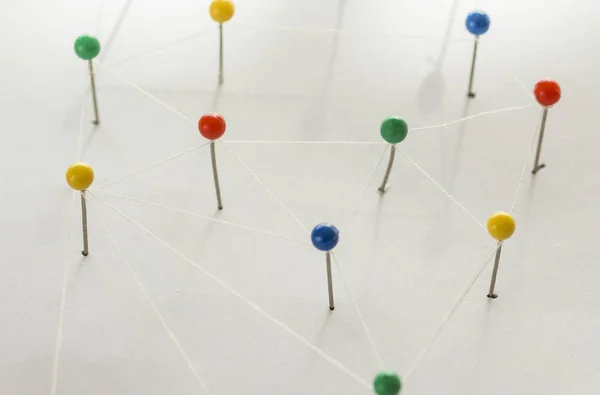 Colorful pins making a network