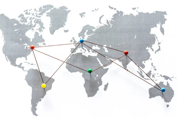 Continents connected by pushpins