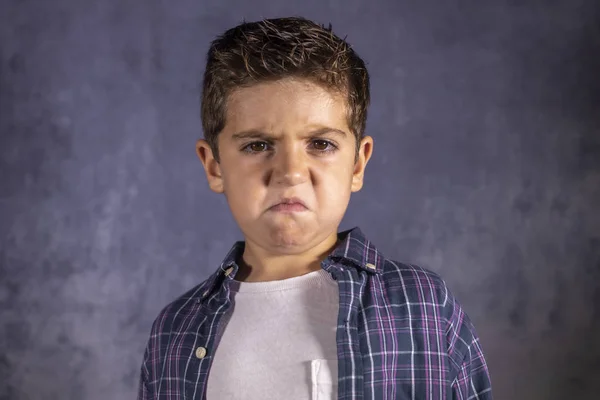 Angry child. Little boy with an angry expression. — Stock Photo, Image