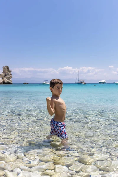 stock image Funny kid on a greek beach on summertime