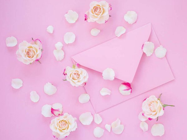 Framework of pink roses and gifts. Spring concept, flat lay, copy space